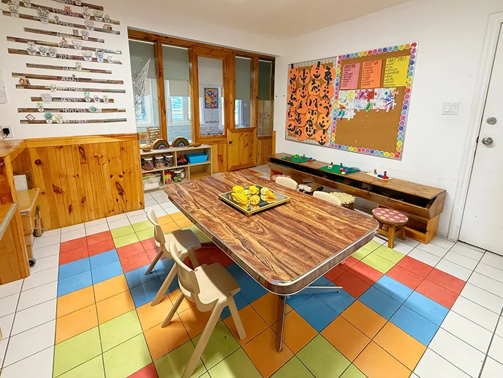 Learning Together Childcare activity room with child-sized furniture and colourful flooring